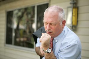 A man struggling with a chronic cough
