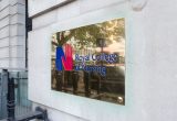 A sign bearing the Royal College of Nursing name and logo outside its headquarters in London